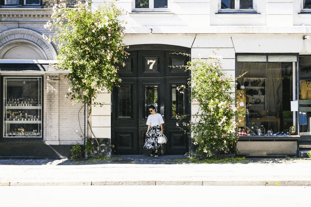 girl in front of a building entrance