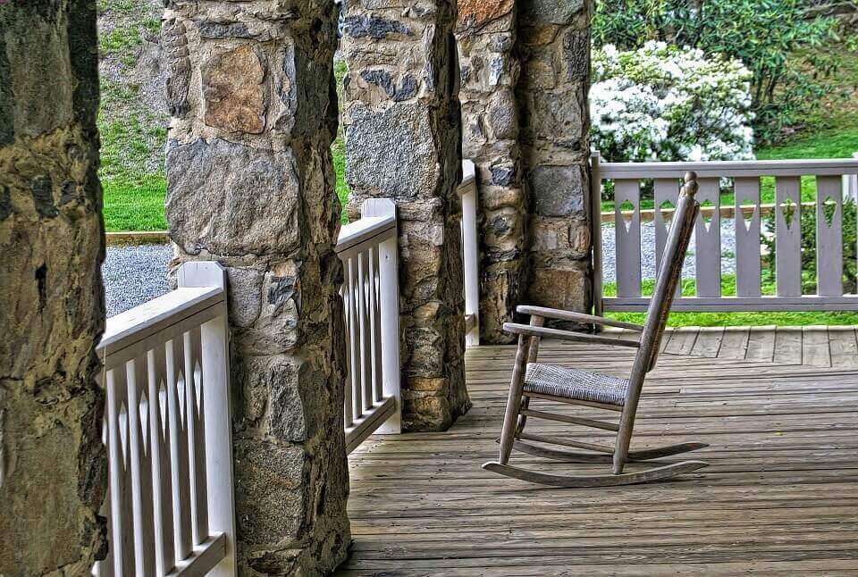 a rocking chair on the deck