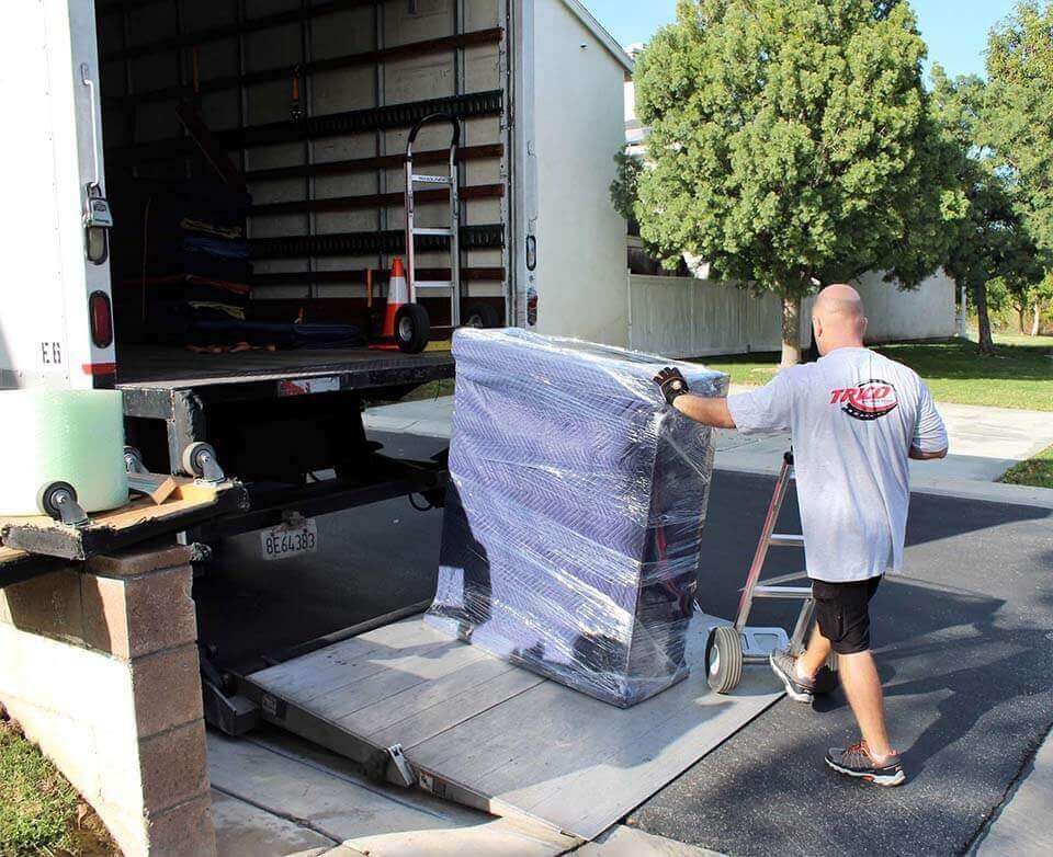 mover loading a couch