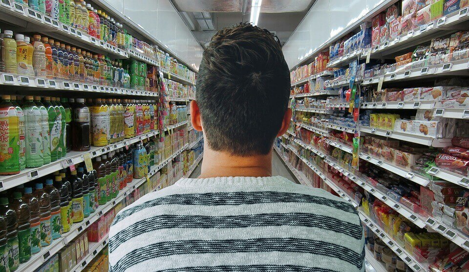 man in grocery aisle