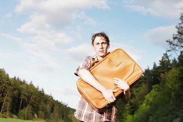 man holding a suitcase