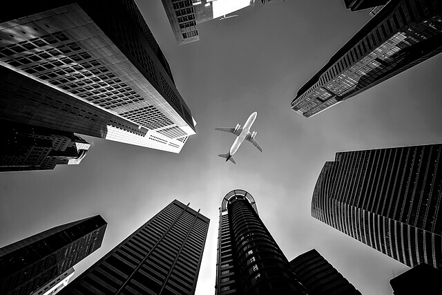 plane over the buildings