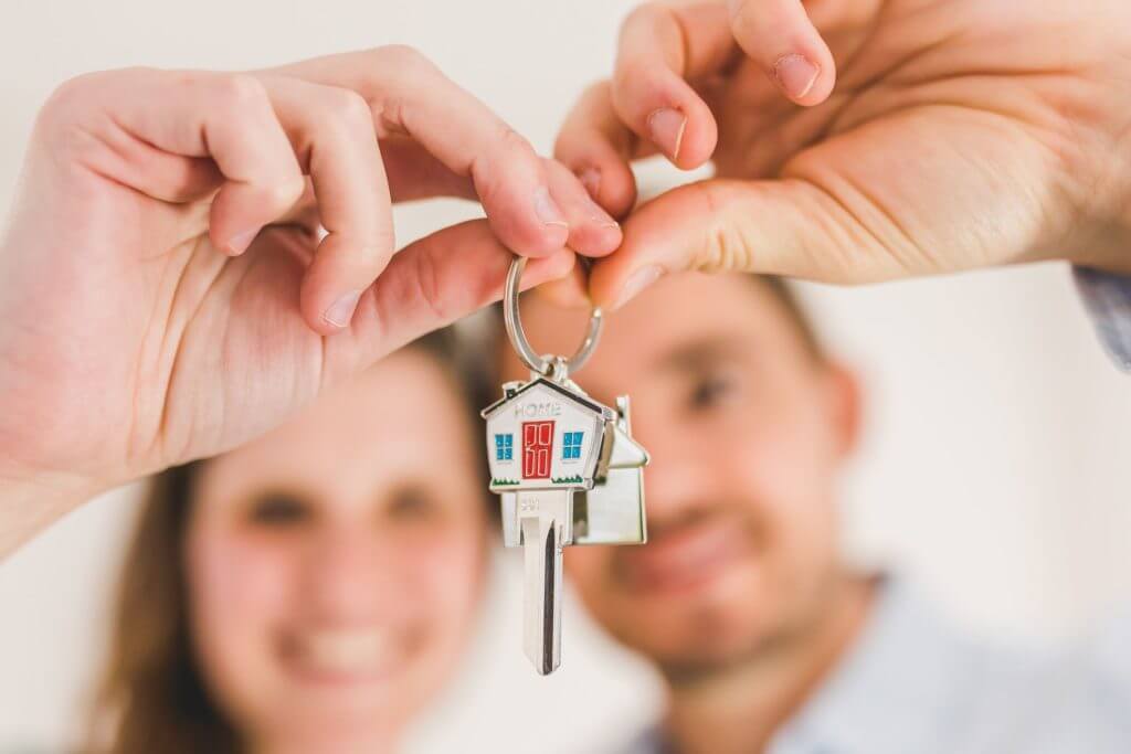  A couple holding house keys