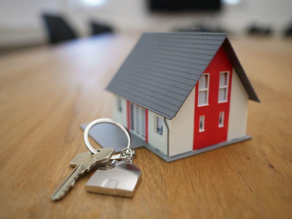 model of a house and keys
