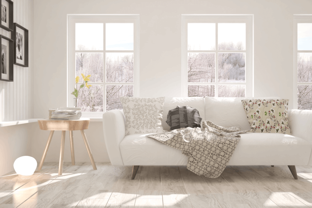  A white living room with a white sofa