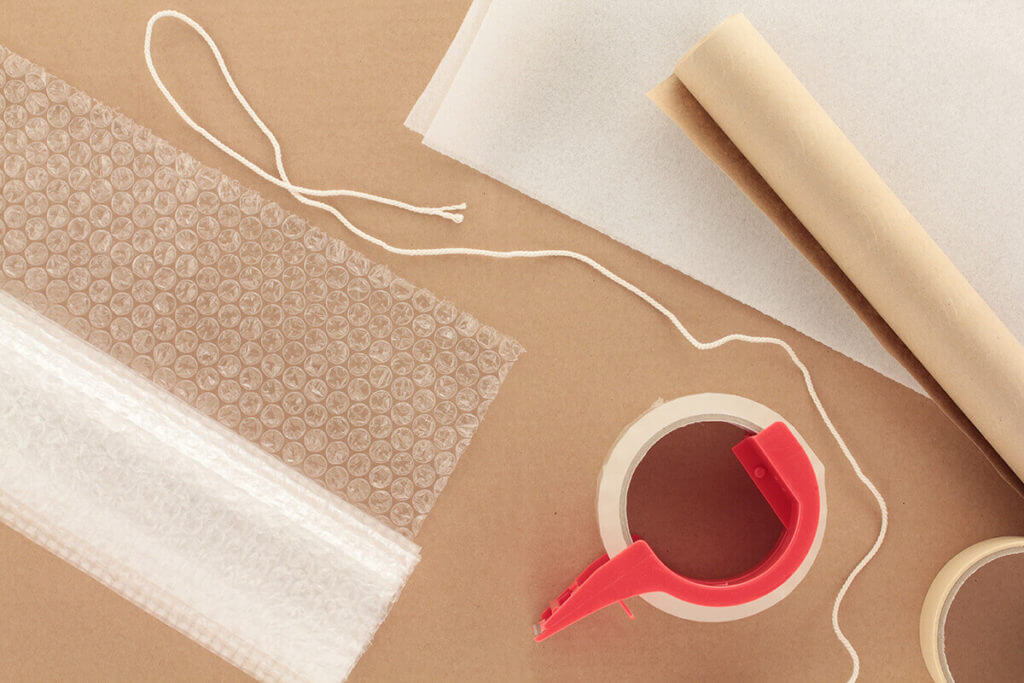 Packaging paper, bubble wrap, tape, and other packaging materials