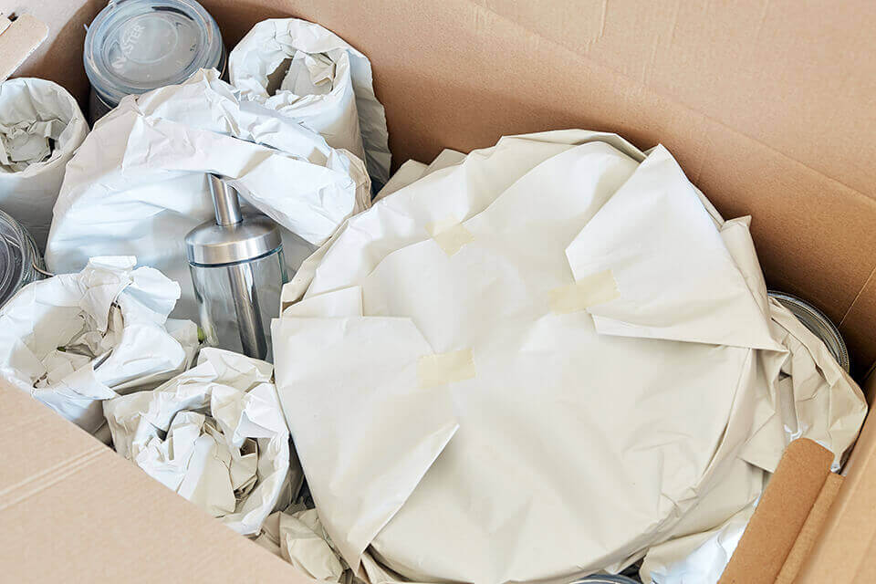 A package full of wrapped dishes