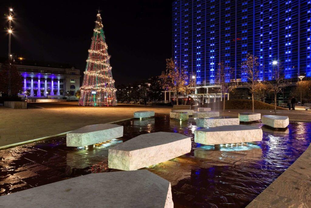 Main Street Garden Park at night, with a Christmas tree