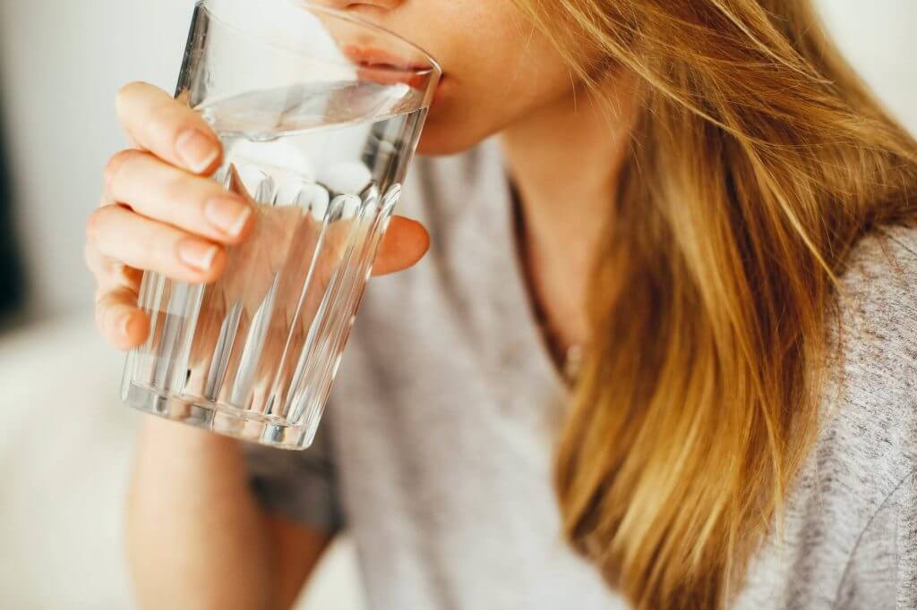 A woman with a glass of water