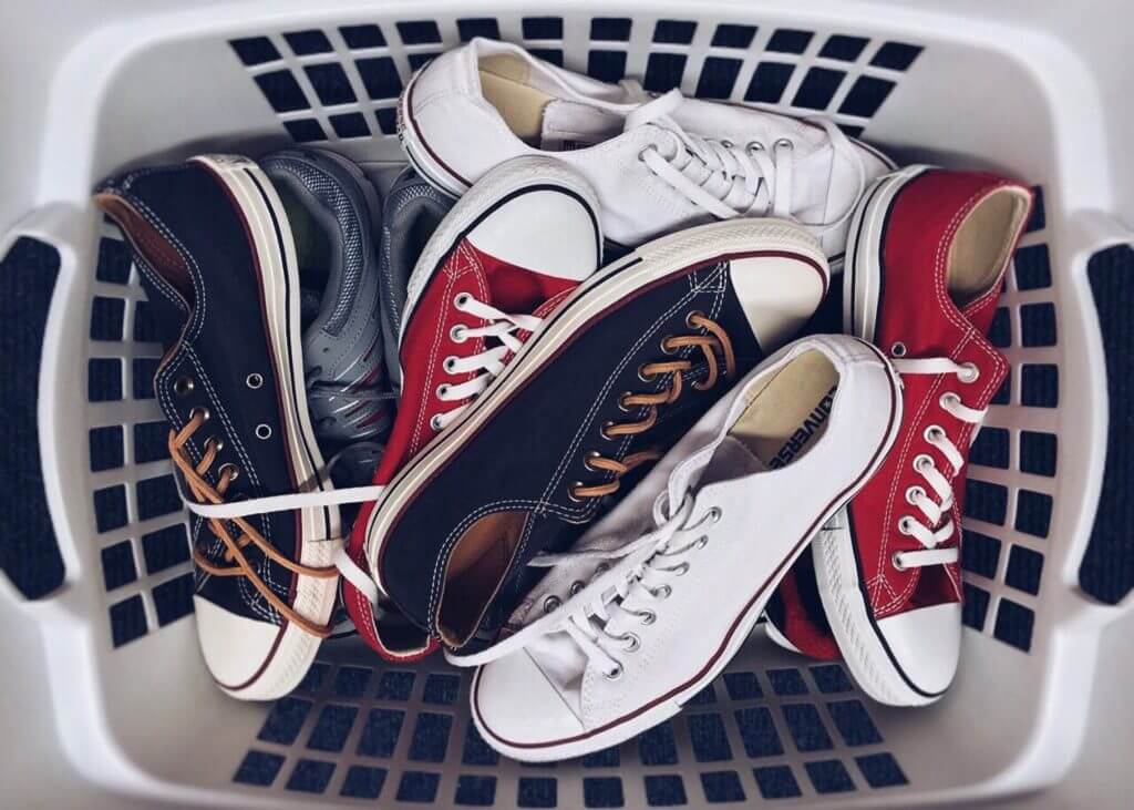 Shoes in a laundry basket before long-distance moving
