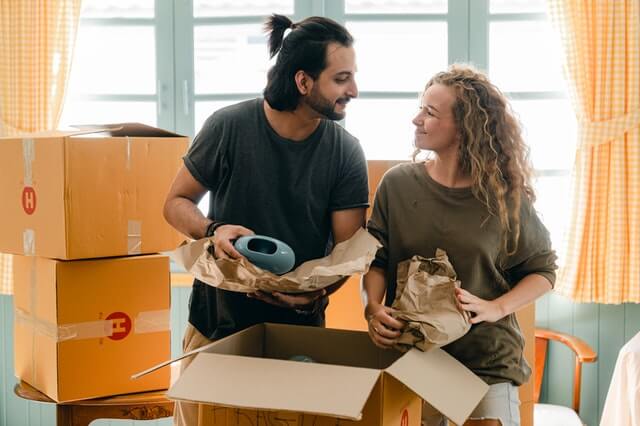 Man and woman packing for moving interstate    