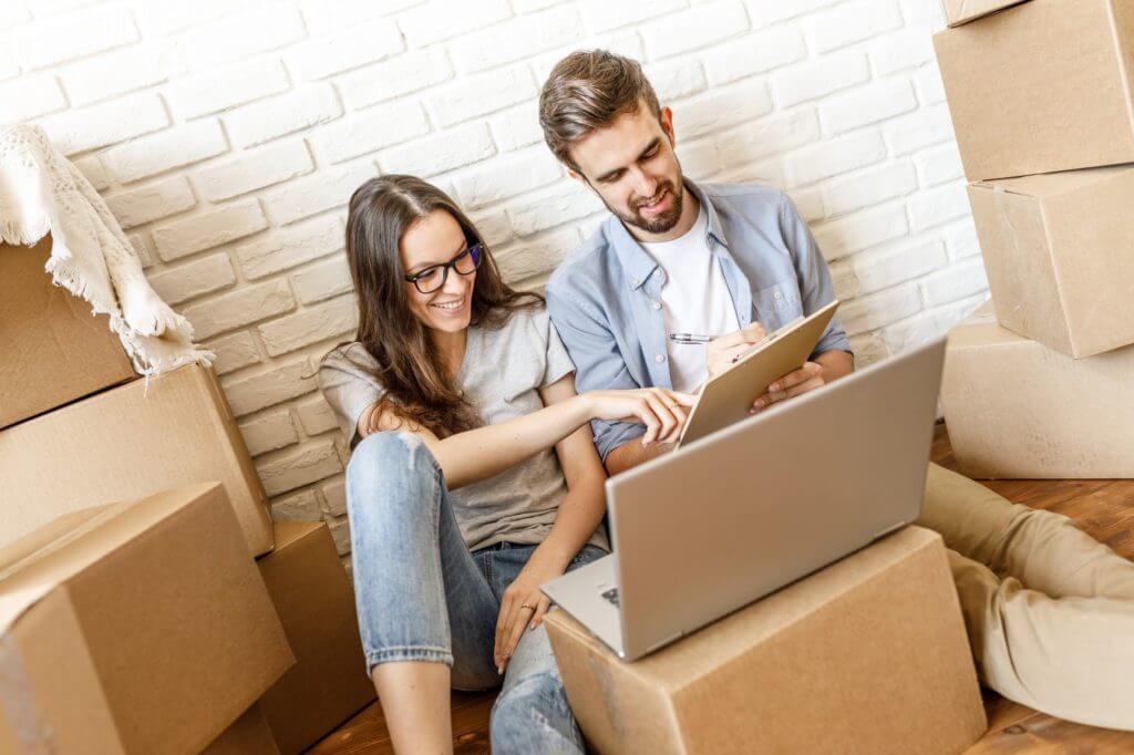 two people looking up a long-distance moving company