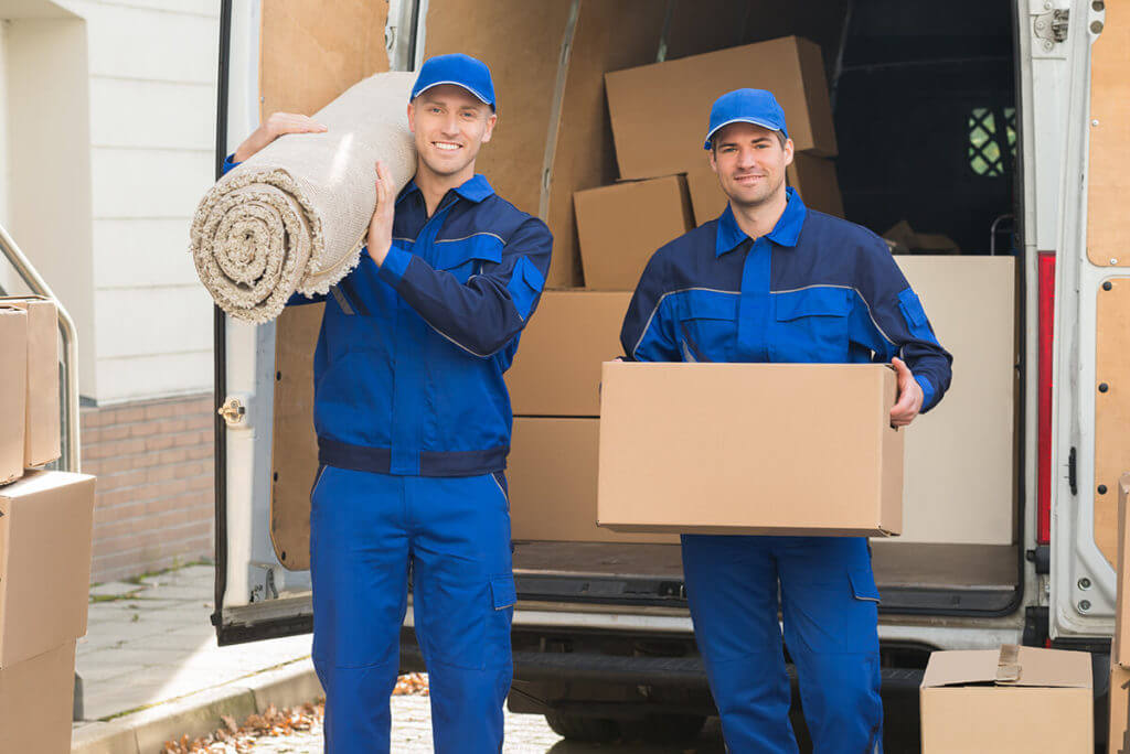 long-distance movers packing a moving truck