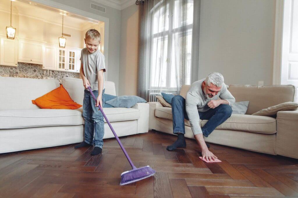 Man and boy washing a floor after cross country moving
