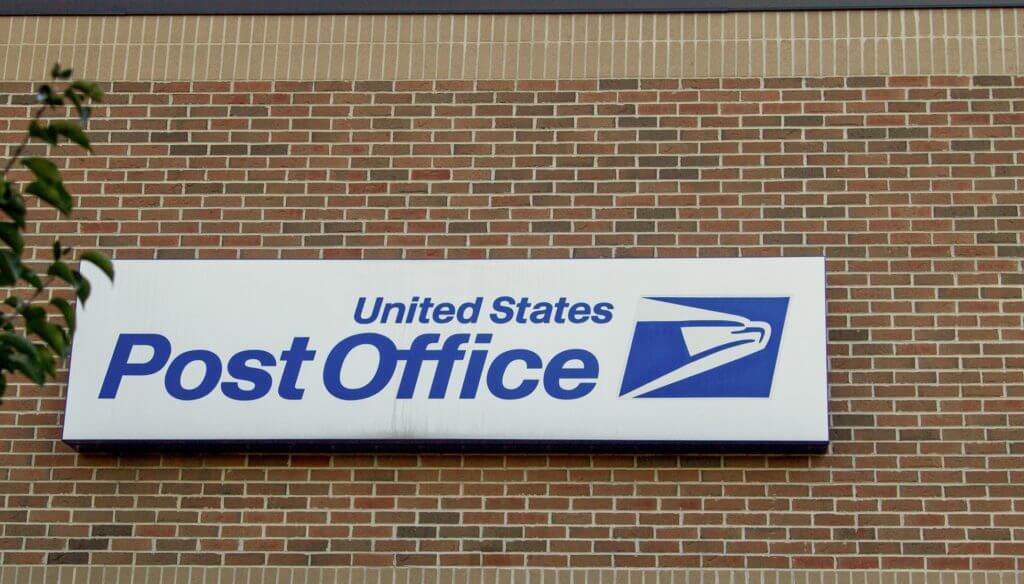 The USPS sign on their building
