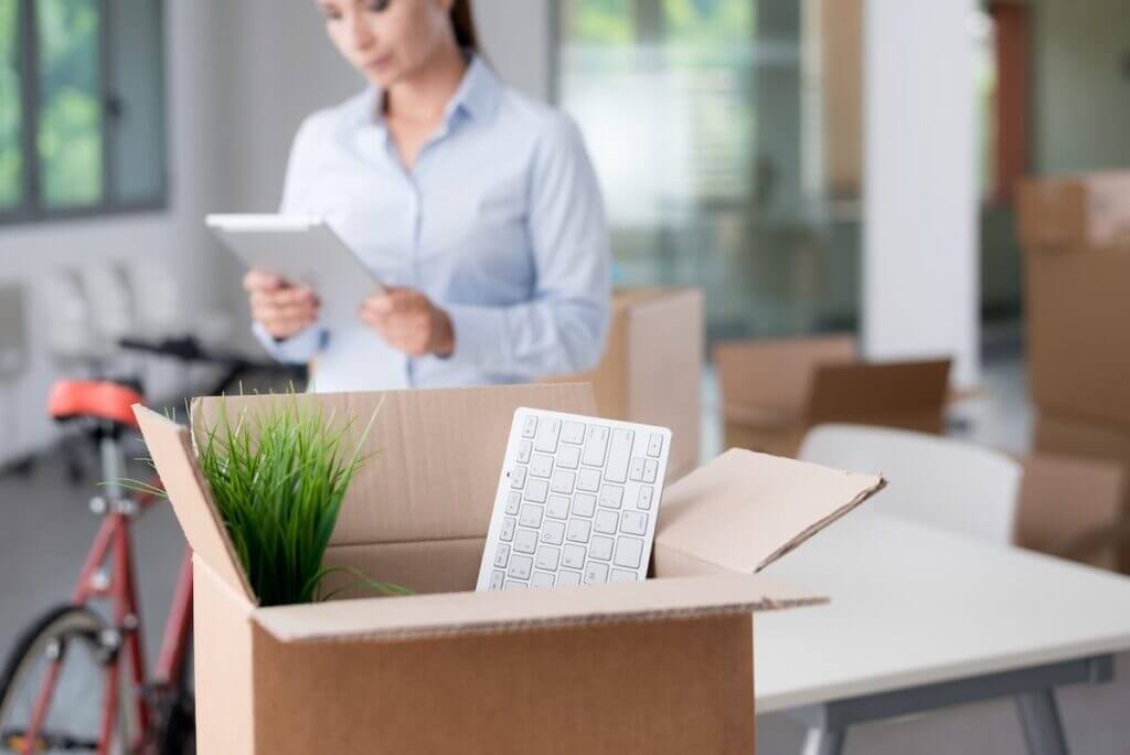 Woman preparing boxes for long-distance moving