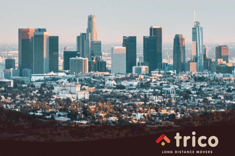 Drone view of Downtown Los Angeles Trico Long Distance Movers Logo