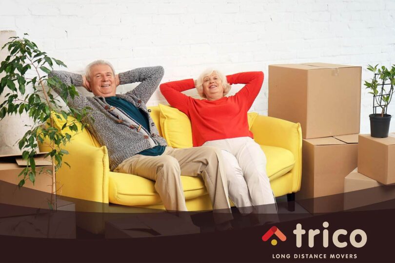 An elderly couple relaxing on the sofa