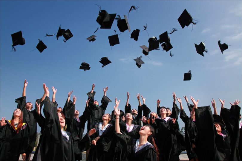 Students throwing their caps during the graduation ceremony