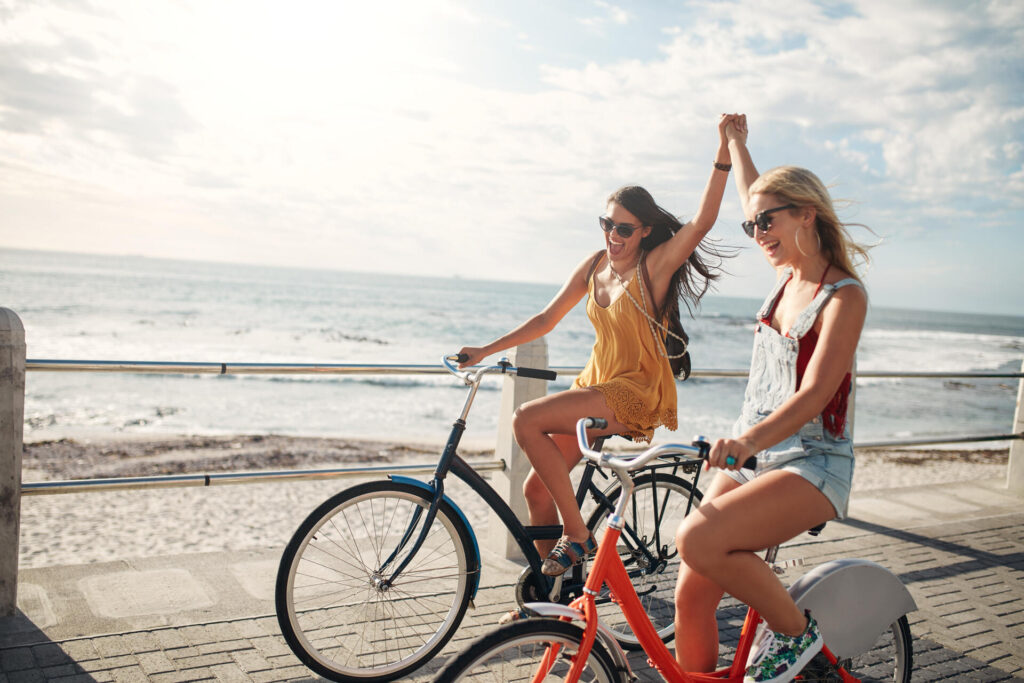 Two girls riding bicycles