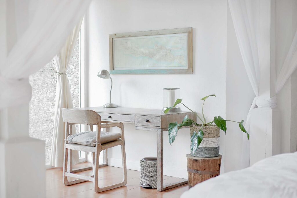 White bedroom with a desk 