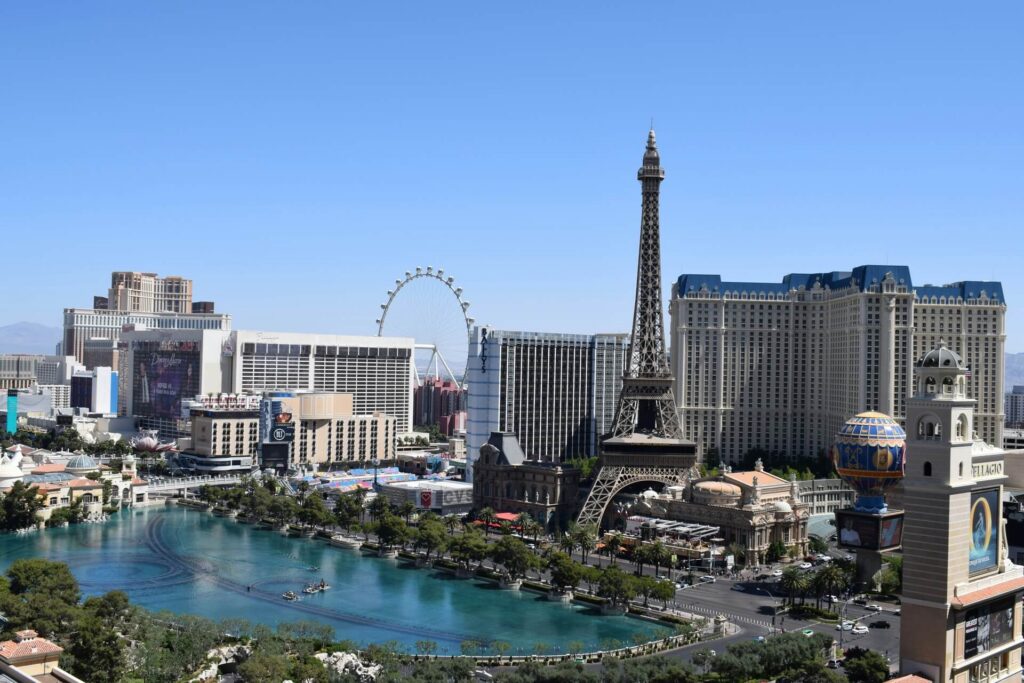 A modern architectural view of luxury resort buildings along the water in Las Vegas.